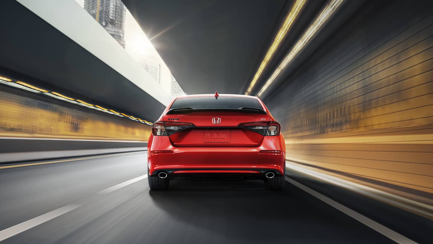 rear view of 2026 honda civic si driving on road