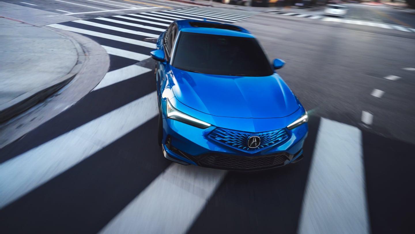 blue acura integra driving on road