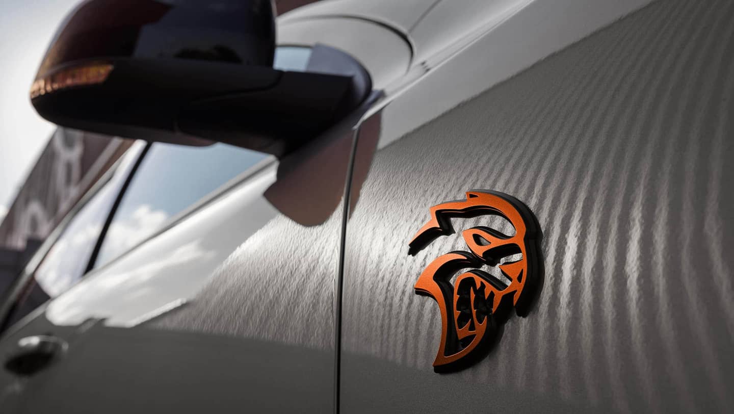 close up dodge durango orange emblem