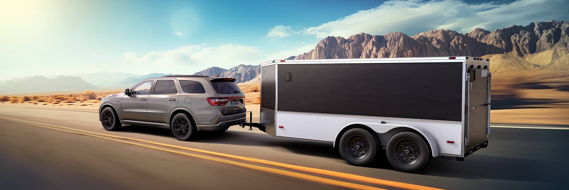 dodge durango hauling on road with mountains