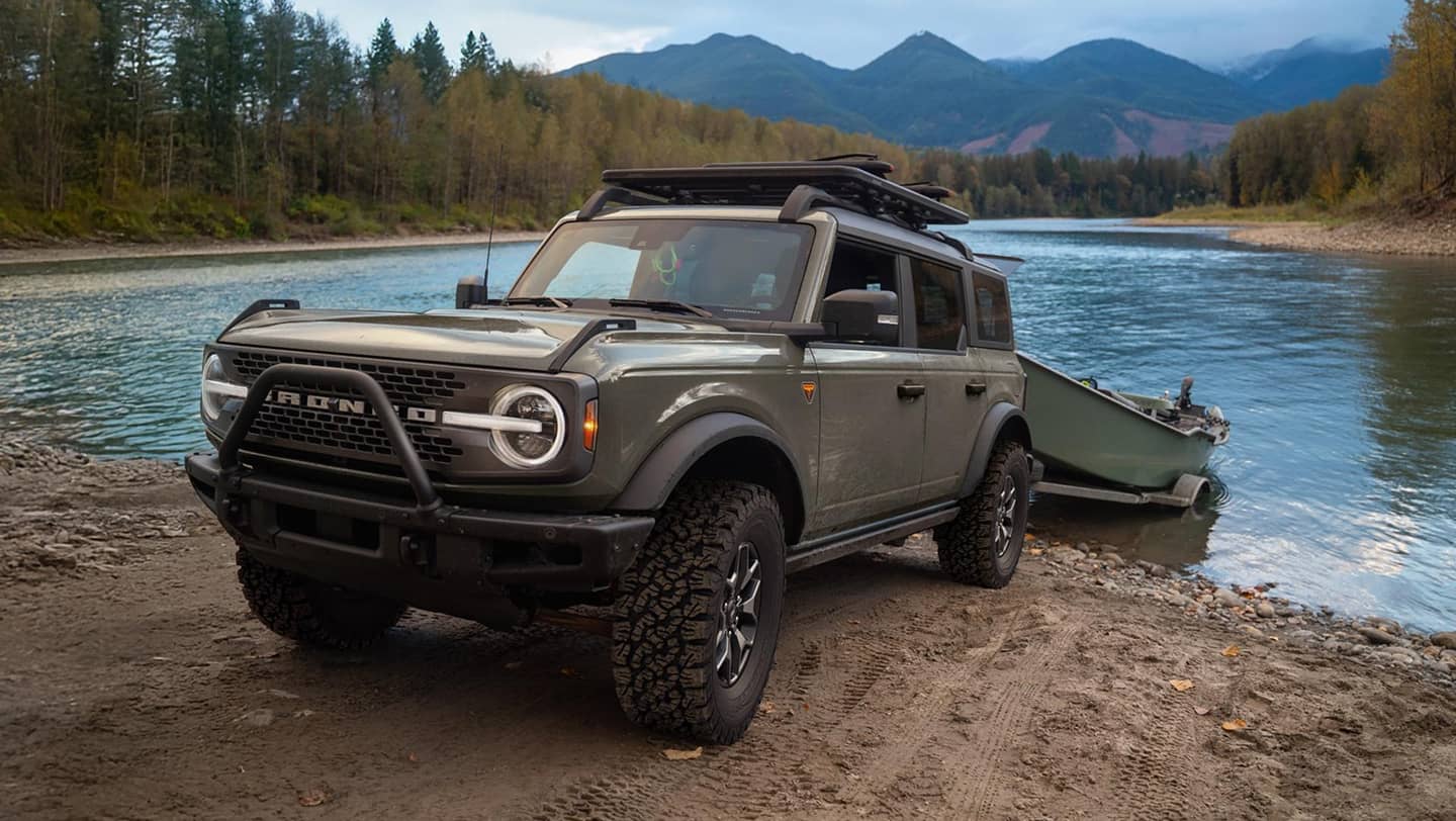 2026 bronco trailing a boat near water