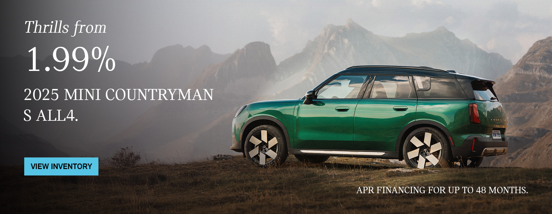 Side view of MINI Countryman driving up a country road.