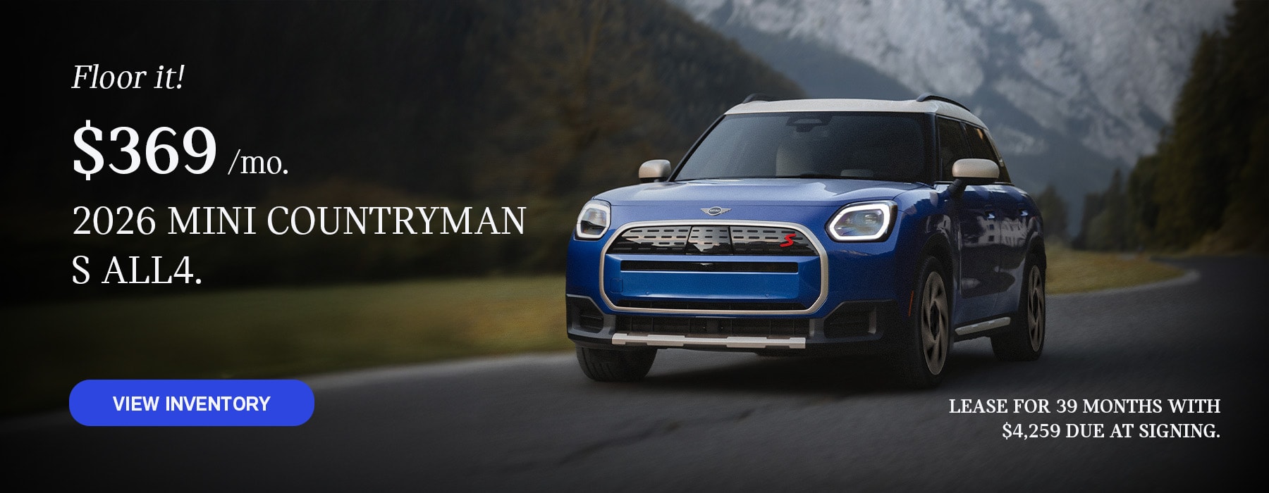 Front view of a blue MINI Countryman  driving on a mountainous road.